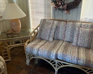 Rattan Loveseat with Patterned Cushions