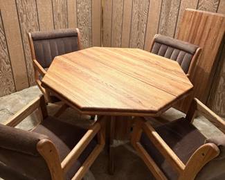 Oak Finish Octagonal Table with Four Upholstered Rolling Chairs and Leaf
