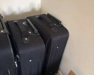 Assortment of Black Luggage