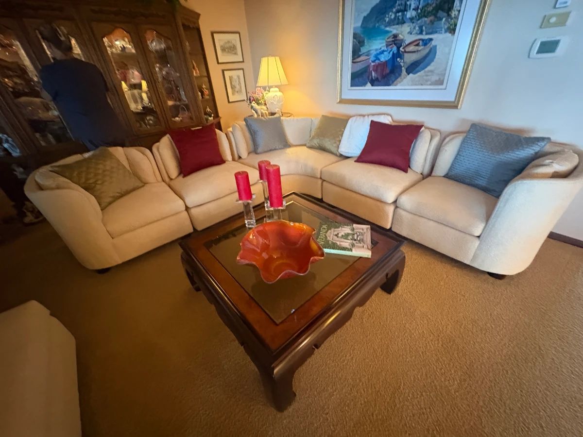 . . . wonderful sectional couch and glass coffee table...