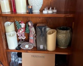 . . . book shelves filled with battery candles and other accents