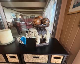 . . . elephant holding decorative orbs