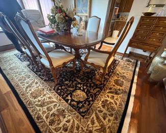 . . . a great dining room set on area rug that retailed at $12,000.00