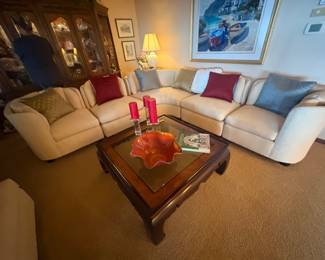 . . . wonderful sectional couch and glass coffee table...