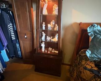 . . . petite curio cabinet stuffed with Lladros!