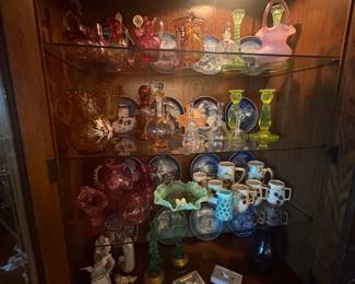 . . . shelves of Fenton and other art glass