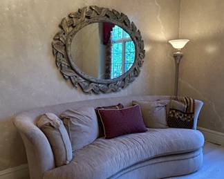 Curved Upholstered Sofa with Decorative Oval Mirror