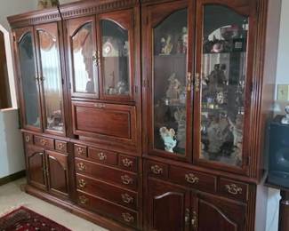 3-section, lighted curio cabinets with lower cabinets and drawers