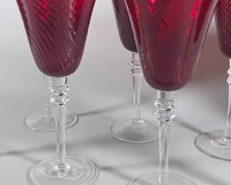 Set of eight ruby red glasses with clear stems