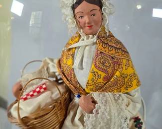 Traditional French Santon dolls in glass cloche displays
