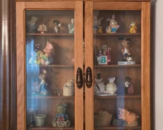 Double door curio with miniature collectibles