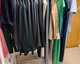 Various mens suits and women's clothes