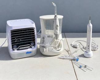 b Arctic Air Compact Evaporative Air Cooler, Waterpik and Braun Oral B
