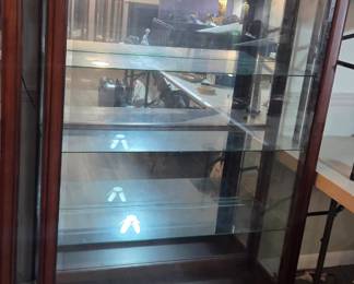 #22	Wood Display Cabinet w/3 Glass shelves and Beveled Glass door that slides both ways on Front - lighted - 42x15x60 w/plate rail on back glass shelf	 $200.00 