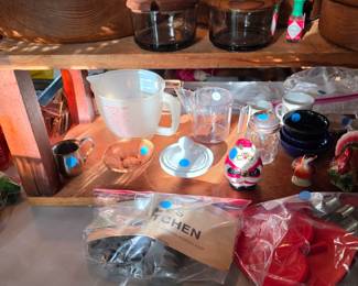 Cookie press, cookie cutters, measuring bowls, salt and pepper shakers