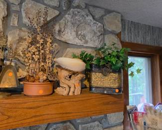Floral arrangements and driftwood with large shell