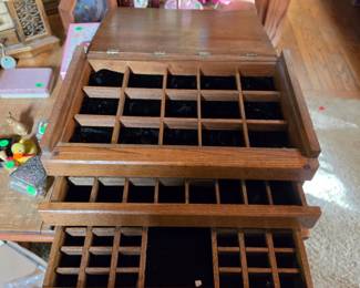 Inside of large wood jewelry box
