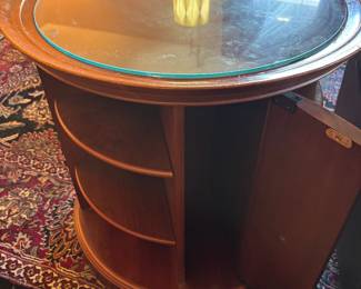 Rotating end table w shelves and storage $ 175.00.   25” diameter 26”t