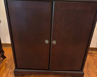 Mahogany color TV cabinet $125.00.  34”w 20”d 37”t