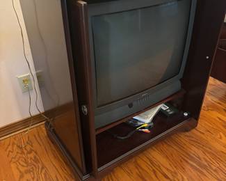 Mahogany color TV cabinet $125.00.  34”w 20”d 37”t