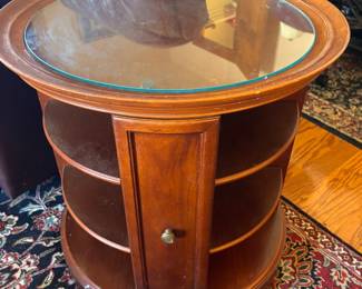 Rotating end table w shelves and storage $ 175.00.   25” diameter 26”t