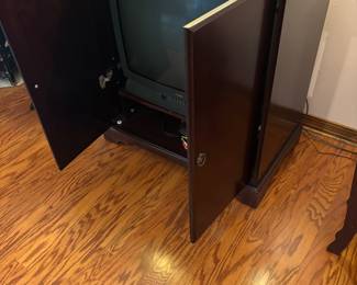 Mahogany color TV cabinet $125.00.  34”w 20”d 37”t