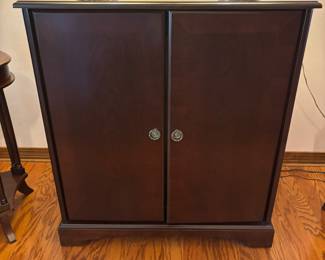 Mahogany color TV cabinet $125.00.  34”w 20”d 37”t