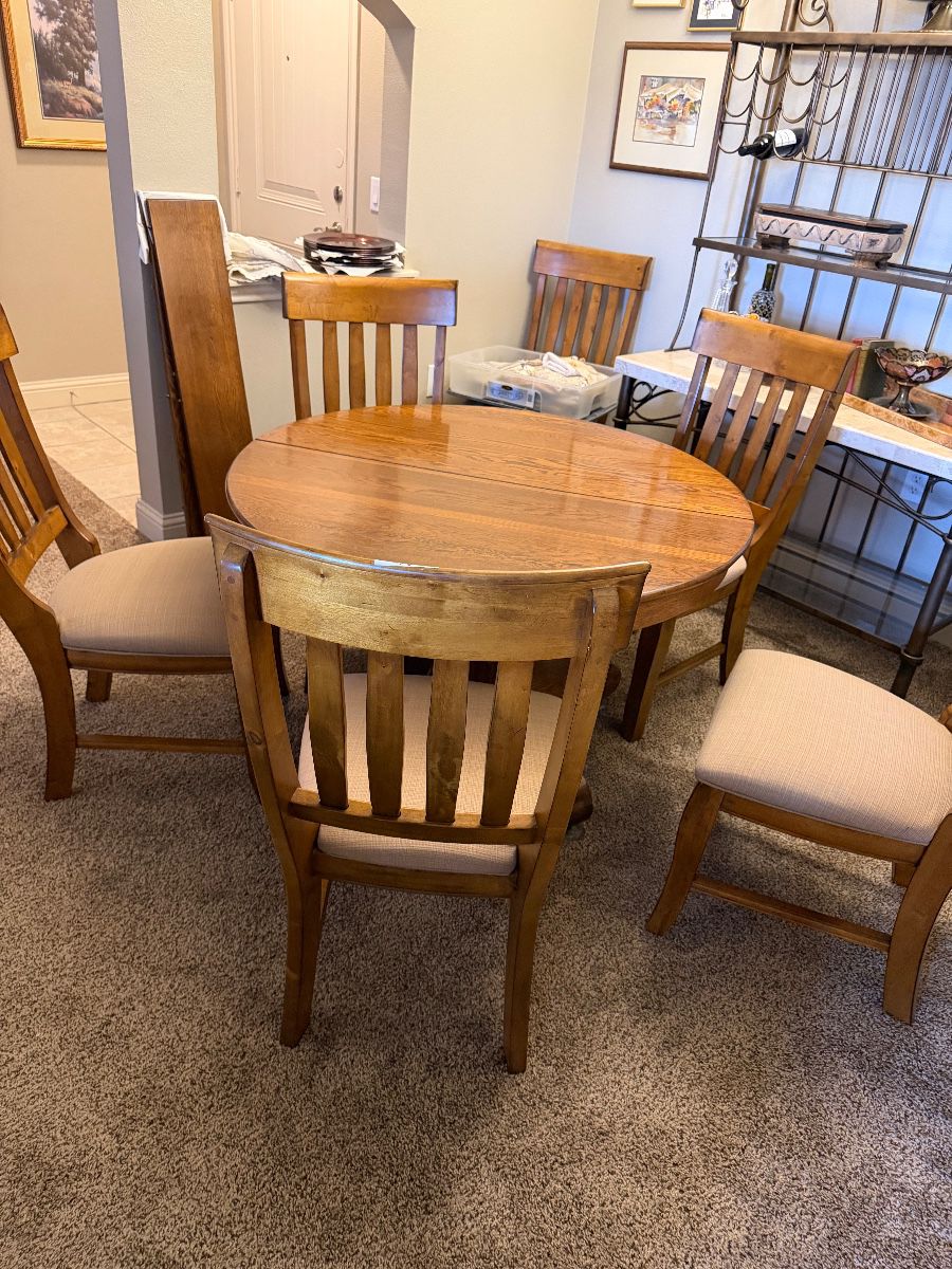 1919 Antique Table- 45” round and has 2 leaves to make it oval