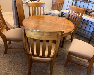 1919 Antique Table- 45” round and has 2 leaves to make it oval