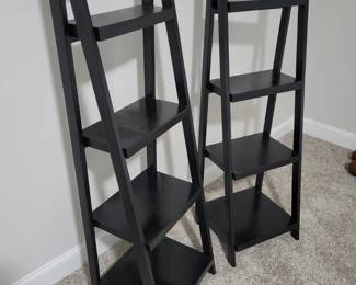 2 Black Tiered Shelves, 53” Tall and 17” wide, 14” deep at base.