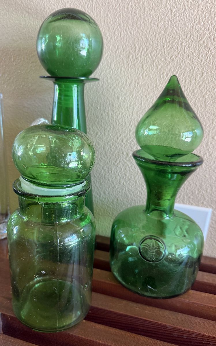 Green glass bottles and decanters