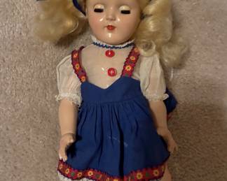 Vintage doll in blue outfit