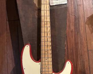Red electric bass guitar