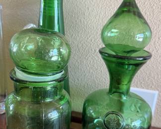 Green glass bottles and decanters