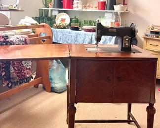 VINTAGE DOMESTIC SEWING MACHINE IN THE STAND
