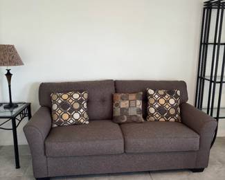 Brown Loveseat And Pillows