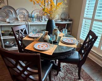 Hand carved round mahogany table with marble top, nice rug