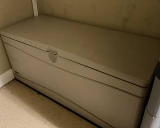Plastic Rubbermaid container filled with water storage containers