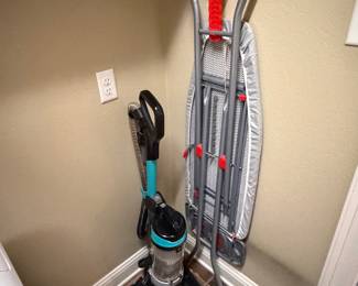 Vacuum cleaner and ironing board