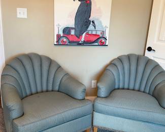 Pair of channel back vintage chairs with brass rollers