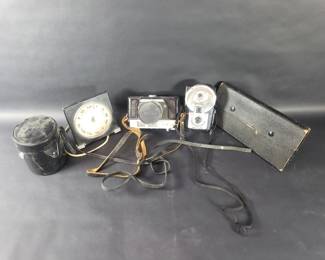 768  Lot 333  Group of vintage camera, desk clock, lamp, etc.