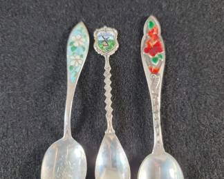 181  Lot 115  Three sterling silver and enamel souvenir spoons