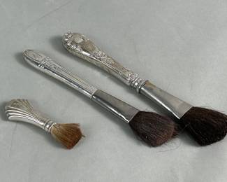 126  Lot 9  Group of vintage makeup brushes with sterling