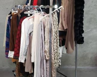 552  Lot 195  Rack of womens designer clothes