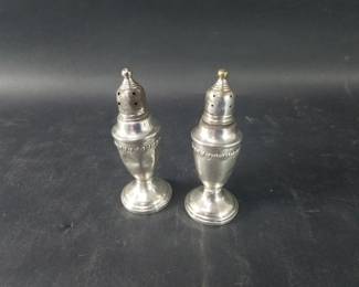 222  Lot 385  Sterling silver weighted salt and pepper shakers