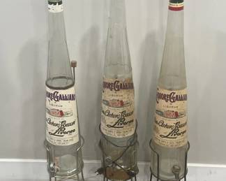 237  Lot 483h  3 large liquor Galliano empty bottles with stand
