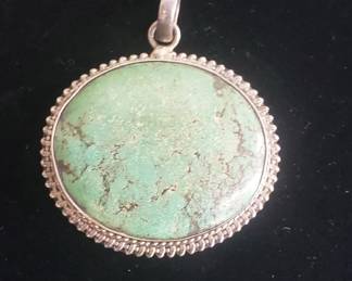 178  Lot 8  Oval green turquoise gemstone pendant set in a