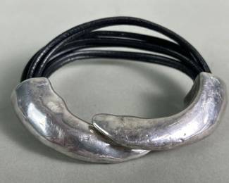 353  Lot 35  Silver and leather bracelet