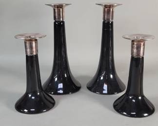 355  Lot 253  Four ceramic and silver candlesticks