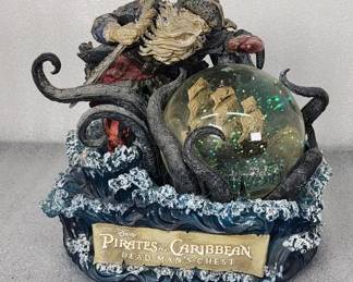 072  Lot 395h  Disney Pirates of Caribbean music box snow globe